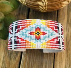 Gorgeous Navajo Beaded Leather Cuff Bracelet. Such amazing craftsmanship! Cuff has an inside circumference of 5 3/4 inches with a 1 1/4 inch gap. Width is 1 1/4 inches. Thank you for checking out our store! Please contact us with any questions. Handmade Southwestern Beaded Bangle Bracelet, Luxury Southwestern Bracelets With Inlay, Southwestern Beaded Bangle Bracelets, Navajo Beaded Accessories, Southwestern Beaded Bangle Bracelet, Beaded Leather Bracelet, Bracelet Style, Leather Cuff Bracelet, Leather Cuffs Bracelet