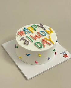 a birthday cake with the words happy you're dad written on it and confetti sprinkles