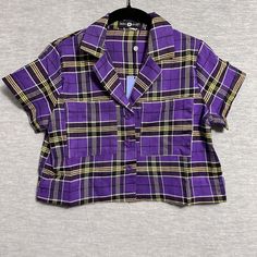 Trendy Purple Collared Shirt, Purple Button-up Top With Buttons, Trendy Plaid Button-up Tops, Trendy Collared Plaid Tops, Purple Short Sleeve Tops With Pockets, Plaid Camp Collar Tops With Relaxed Fit, Purple Short Sleeve Top With Button Closure, Casual Plaid Tops With Placket, Relaxed Fit Plaid Top With Buttons