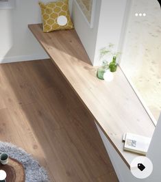 an aerial view of a living room with wood flooring