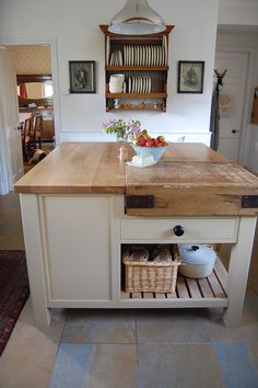 a kitchen with an island and wooden counter tops