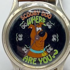 Unisex Scooby-Doo Watch, Where Are You? Theme. Warner Bros Collection Watch By Fossil. Silver Tone Case. The Spooky Eyes Move Back And Forth To Indicate Seconds! Some Glow-In-The-Dark Elements. This One Is A Real Collector's Item. The Band Is Original To The Watch And Is Brown Leather, Looks Good From The Outside When Worn, But Unfortunately The Back Is Faux Leather And Is Peeling. Easily Replaced With Any Brown Leather Band, Or You Could Just Peel Away The Faux Leather Lining And Wear It As Is. Glass And Case Are In Good Used Condition With Faint Scratches. Note: I Don't Have A Battery For This Watch And Don't Want To Risk Damaging It When Opening The Back, So I Can Only Assume It Works; Ha Silver Analog Display Watch, Retro Silver Watch With Analog Display, Retro Silver Watch Accessories With Subdials, Silver Retro Watch Accessories With Subdials, Retro Analog-style Collectible Watch Accessories, Vintage Silver Watch With Analog Display, Silver Analog Display Watches For Collectors, Silver Analog Display Watch For Collectors, Collectible Silver Watch With Subdials