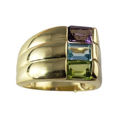 Vintage 14 Karat Yellow Gold Peridot, Amethyst and Topaz Ring Size 6.25- This elegant ring features one amethyst , one peridot and one blue topaz set in beautifully detailed 14K yellow gold. Width: 13 mm. Shank: 3 mm. Size: 6.25 Weight: 6.5 gr./ 4.1 dwt. Stamped: 14K Very good condition, professionally polished. Will come packaged in a gift box or pouch (when possible) and will be shipped U.S. Priority Mail Insured. DV061223/17KCS JAGI ID 10/31/23 Luxury Multi-stone Birthstone Ring For Formal Occasions, Luxury Multi-stone Birthstone Ring For Formal Events, Modern Multi-stone Gemstones For Anniversary, Yellow Gold Amethyst Cabochon Ring, Luxury Gold Multi-stone Amethyst Ring, Antique Gold Amethyst Multi-stone Ring, Luxury Yellow Gold Amethyst Cabochon Ring, Vintage 14k Gold Multi-stone Amethyst Ring, Topaz Yellow