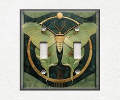 a green and gold butterfly light switch plate cover