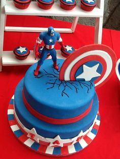 a captain america themed birthday cake and cupcakes