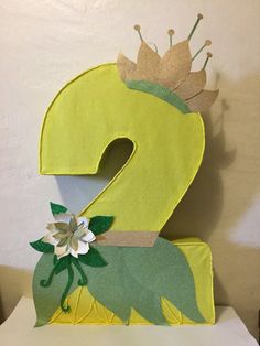 the number two is made to look like a flower and has a crown on top