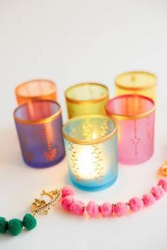 colorful candles and beads on a white surface