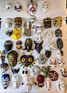 many masks are arranged on a white sheet