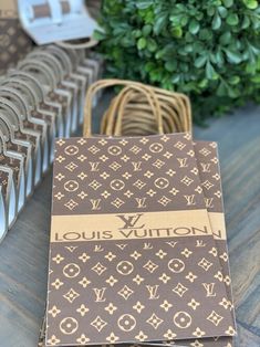 louis vuitton notebooks lined up on a table