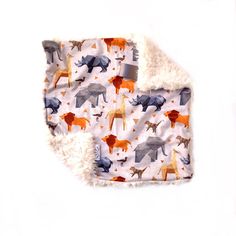 a blanket with animals on it and a white background