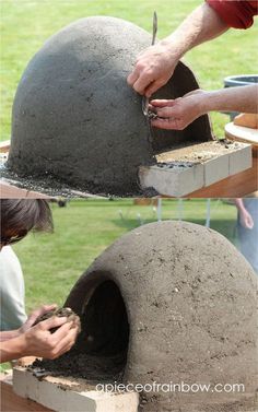 someone is making an oven out of cement