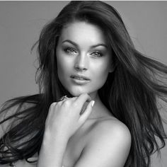 a beautiful woman with long hair posing for a magazine cover photo, in black and white