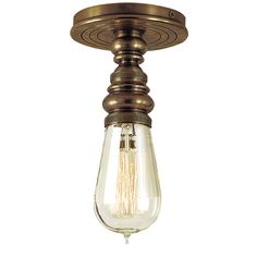 a light fixture with an old fashioned bulb