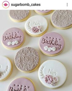 decorated cookies with the words happy birthday written in frosting on them and surrounded by flowers