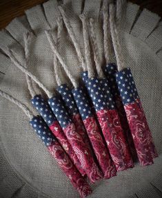 six red, white and blue umbrellas sitting on top of a burlock