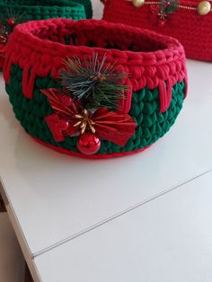 three christmas baskets sitting on top of a table