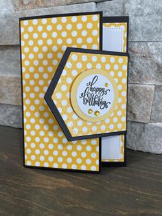 a yellow and white polka dot card with a happy new year's message on it