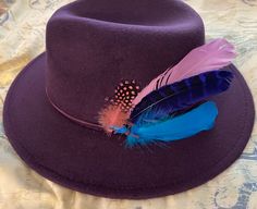 This is a beautiful rich purple fedora comes with feathers in rich vibrant colors Ready to ship item SiZe 56 - 58 cm small to medium head Feel free to contact us with questions Has leather string band Purple Feathered Hat For Kentucky Derby, Adjustable Purple Hat With Feathers, Old Bed Frames, Pretty Poodles, Ladies Hat, Mens Hat, Purple Feather, Hat Storage, Rich Purple