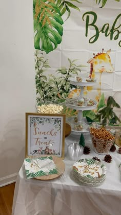 a table topped with lots of food and desserts