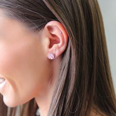 a close up of a person wearing a pair of earrings Pink Diamond Drop Earrings Fine Jewelry, Pink Diamond Drop Earrings In Fine Jewelry Style, Pink Diamond Drop Earrings, Classic Pink Drop Earrings, Elegant Pink Sterling Silver Diamond Earrings, Pink Diamond Earrings Fine Jewelry, Rose Gold Sterling Silver Crystal Earrings, Pink Sterling Silver Round Earrings, Pink Round Sterling Silver Earrings