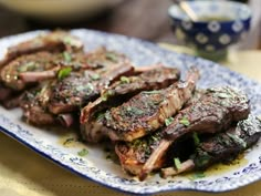 grilled steaks on a blue and white plate