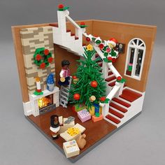 a lego house with stairs and christmas tree