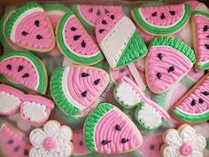 decorated cookies in the shape of watermelon slices