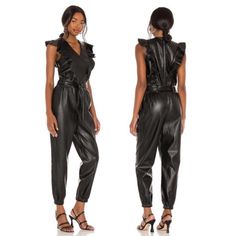 Blank Nyc Tressa Faux Leather Jumpsuit Size: Small Color: Black Condition: Nwot Crafted From Edgy Faux Leather, This Of-The-Moment Jumpsuit Delivers Chic, Statement-Making Appeal. - Jogger Style Pants - Back Zipper Closure - V-Neck, Ruffle Front Details - Removable Belt Fitted Faux Leather Jumpsuit For Work, Fitted Faux Leather Jumpsuits And Rompers For Party, Black Faux Leather Jumpsuits And Rompers For Night Out, Faux Leather Jumpsuits And Rompers For Party, Chic Faux Leather Jumpsuits And Rompers For Night Out, Chic Black Faux Leather Jumpsuits And Rompers, Chic Black Faux Leather Jumpsuit, Chambray Romper, Pleated Jumpsuit