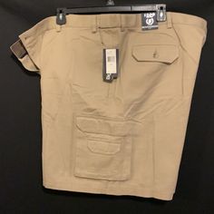 Nwt Izod Khaki Cargo Shorts Size 52 With Extender Waist. Rn16576 Flatfront Inseam 9" Khaki Bottoms With Pockets And Short Inseam, Khaki Shorts With Side Pockets, Khaki Bermuda Bottoms With Pockets, Casual Khaki Shorts With Welt Pockets, Utility Style Shorts With Welt Pockets, Khaki Cargo Shorts, Cargo Shorts, Mens Shorts, Man Shop