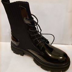 Trendy Black Knit And Glossy Boots. Really Cute And Quality Detailing. Never Worn And Still In The Box. The First Picture Of Is Of The Actual Boot And The Second And Third Are From The Website. I’m Selling Because I Ordered The Wrong Size And The Shipping Price To Return Overseas Was Expensive. Black Knit, Boots Black, Lace Up Boots, One Pic, Black Boots, Shoe Laces, Two By Two, Size 7, Lace Up