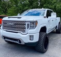 a white truck parked in a parking lot