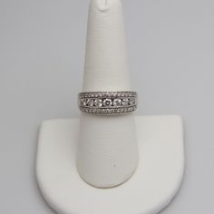 "For sale: (1) d669 14k White Gold Diamond Ring PLEASE READ ENTIRE DESCRIPTION BEFORE PURCHASING Pre-owned item. Good condition. Please see pictures for details. Sold as is, as seen on pictures. This ring contains 39 diamonds, all of which are round cut. This ring is not stamped, but has been tested for authenticity. Specifics: 14k White gold Diamonds: 2.45TCW Size: 8.25 (U.S.) Width: 8.1 mm Total Weight: 6.5 grams Please be 100% sure of your purchase before buying, as we do not offer refunds. W Diamond Wide Band Ring With Prong Setting For Anniversary, Classic White Gold Wide Band Ring With Diamond Cut, Classic Round Wide Band Ring For Anniversary, Classic Wide Band Ring For Anniversary, Classic Jewelry With Single Cut Diamonds In Wide Band, Diamond White Wide Band Diamond Ring For Anniversary, Anniversary Diamond Wide Band Ring With Brilliant Cut, Brilliant Cut Wide Band Ring For Anniversary, Classic Wide Band Ring With Brilliant Cut