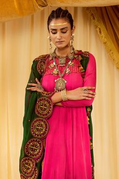 Pink anarkali with embroidery on the yoke and flare. Comes with green dupatta and churidar.
Component: 3
Pattern: Embroidery
Type Of Work: Thread and Mirror
Neckline: Round
Sleeve Type: Full
Fabric: Modal Satin
Color: Pink
Other Details: 
Dupatta with embroidery and scalloped border
Note: Necklace and choker worn by the model is not for sale
Occasion: Wedding - Aza Fashions Round Neck Anarkali, Green Dupatta, Pink Anarkali, Satin Embroidery, Pink Thread, Scalloped Border, Mirror Round, Luxury Sale, Pattern Embroidery