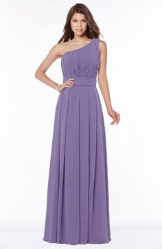 a woman in a long purple dress