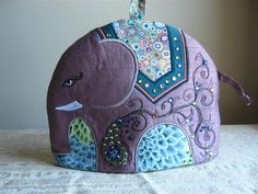 an elephant purse is sitting on a table