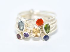 "Chakra Stack Ring, 92 5 Sterling Silver crystal stacking ring, handmade genuine gemstones one of a kind cocktail ring, statement silver ring for her. Using excellent AAA gemstones , Iolite, Amethyst, Garnet, Peridot, Citrine, Carnelian and Blue Topaz. Chakras are the concentrated energy centres of the body. Chakra is a Sanskrit term and it means \"wheel\" or \"disk\" and is derived from the root word \"cakra\". Chakras are spinning wheels of energy/light. Chakras have the loving responsibility Unique Multicolor Stackable Jewelry, Unique Birthstones For Jewelry Making, Unique Birthstone Gemstones For Jewelry Making, Fine Jewelry Stackable Gemstones As Gifts, Fine Jewelry Stackable Gemstones For Gift, Fusion Style Stackable Ring Jewelry, Fusion Style Stackable Open Ring Jewelry, Stackable Open Ring Fusion Jewelry, Fusion Style Natural Stone Ring