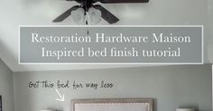 a bed room with a ceiling fan and some pictures on the wall next to it