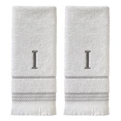 two white towels with the letter t on each towel and one has a gray monogram