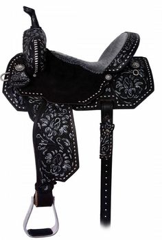 a black and white western saddle with floral design on the front, side and sides