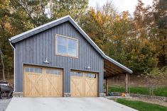 a two car garage with an attached carport