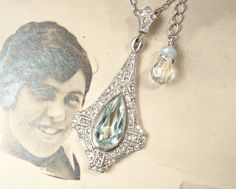 "I am so excited to be offering a beyond stunning antique Art Deco/Edwardian 1920s to 1930s era soft aquamarine blue open back cut crystal and clear paste rhinestone pendant necklace. The perfect \"Something Old\" and \"Something Blue\" for the Bride! Photos don't begin to do this one justice. The stunning just 2 3/8 inches (6 cm) long (including the bale) pot metal ornate pendant features a phenomenal open backed light aqua blue sparkly large pear cut glass crystal. The rest of the setting is l Bride Photos, Vintage Rhinestone Jewelry, Light Aqua, Something Old, Blue Jewelry, Aquamarine Blue, Rhinestone Jewelry, Antique Art Deco, Glass Crystal