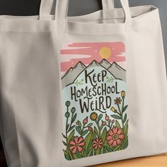 Carry your homeschooling spirit everywhere you go with this unique and eco-friendly tote bag featuring an inspirational "Keep Homeschool Weird" message adorned with a charming mountain and floral design. Made from durable canvas, this tote is perfect for books, groceries, or just a day out. Support sustainable fashion with a tote that speaks to your quirky homeschool values and love for nature's beauty.    Choose a matching tumbler, too! The straight, skinny design makes it a perfect fit for most cup holders and comfortable to hold. It comes with a clear, BPA-free lid, and metal straw, ensuring your beverages stay secure and spill-free. Whether for a personalized gift or to elevate your drinkware collection, our 20oz Straight Skinny Sublimation Tumbler is an outstanding choice. Homeschool Gifts, Boho Tote Bag, Boho Tote, Beach Tote Bag, Beach Tote, Canvas Tote Bag, Canvas Bag, Canvas Tote, Sustainable Fashion