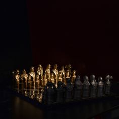 a chess board with golden figures on it