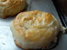 two pastries sitting on top of a baking pan