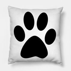 a black and white dog paw print on a pillow