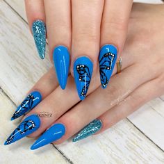 Butterfly nails, blue nails, stiletto nails, almond nails, glitter nails, spring nails, gel nails Blue Nails Stiletto, Butterfly Nails Blue, Spring Nails Gel, Summer Stiletto Nails, Blue And Silver Nails, Butterfly Nails, Blue Acrylic Nails