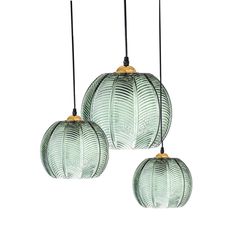 three green glass pendant lights hanging from the ceiling