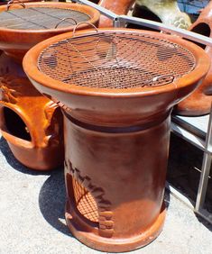 several clay pots sitting next to each other