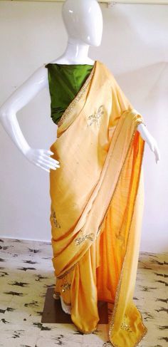 Sunny yellow semi silk saree with sequin and bead hand embroidered dragonflies with dark oilve green Yellow Tissue Silk Pre-draped Saree With Dori Work, Gold Silk Pre-draped Saree With Mirror Work, Yellow Embroidered Raw Silk Blouse Piece, Yellow Silk Blouse With Dori Work, Yellow Silk Blouse Piece With Dori Work, Gold Embroidered Silk Pre-draped Saree, Yellow Raw Silk Blouse Piece With Zari Work, Yellow Raw Silk Traditional Wear With Mirror Work, Pista Green Art Silk Saree With Gota Work