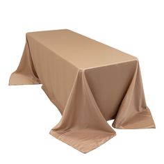 a table covered with a beige cloth